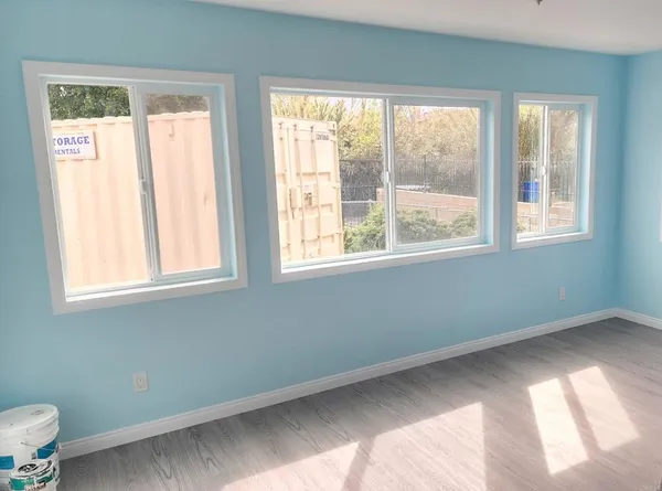 a view of an empty room with a window