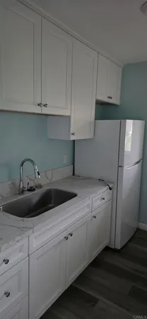 a kitchen with a sink and cabinets