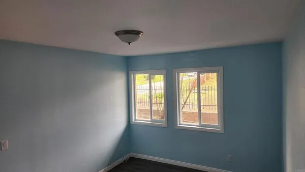 a view of a big room with windows