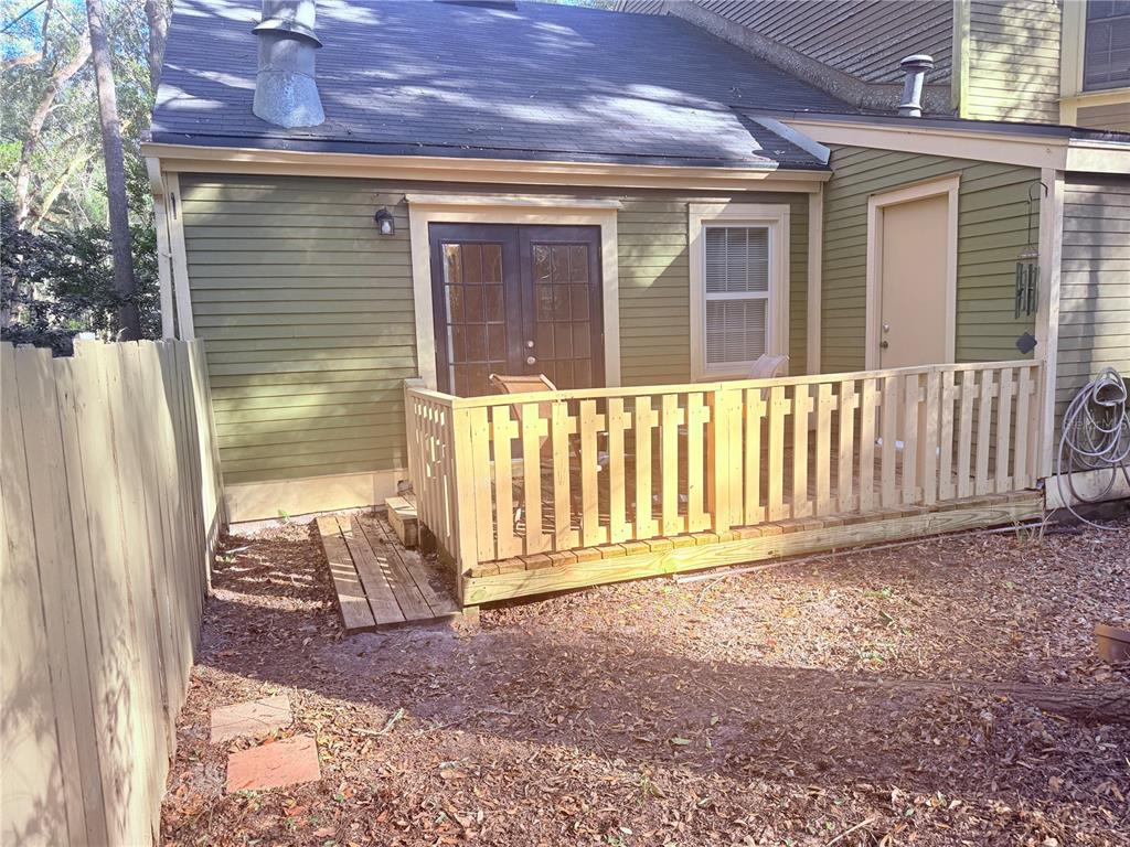 5134 Southwest 92nd Court Gainesville, FL 32608 - Photo 20 of 20 a view of a backyard with a small cabin