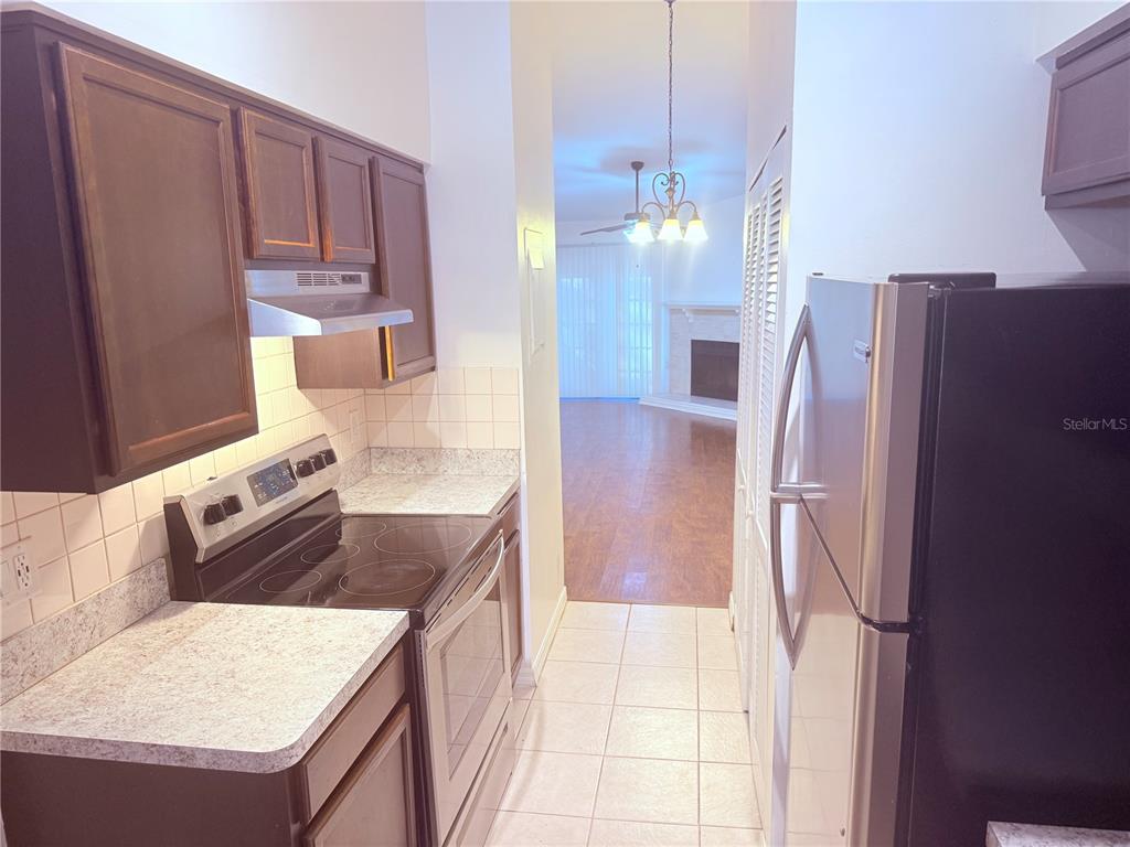 5134 Southwest 92nd Court Gainesville, FL 32608 - Photo 9 of 20 a kitchen with stainless steel appliances granite countertop a refrigerator and a stove