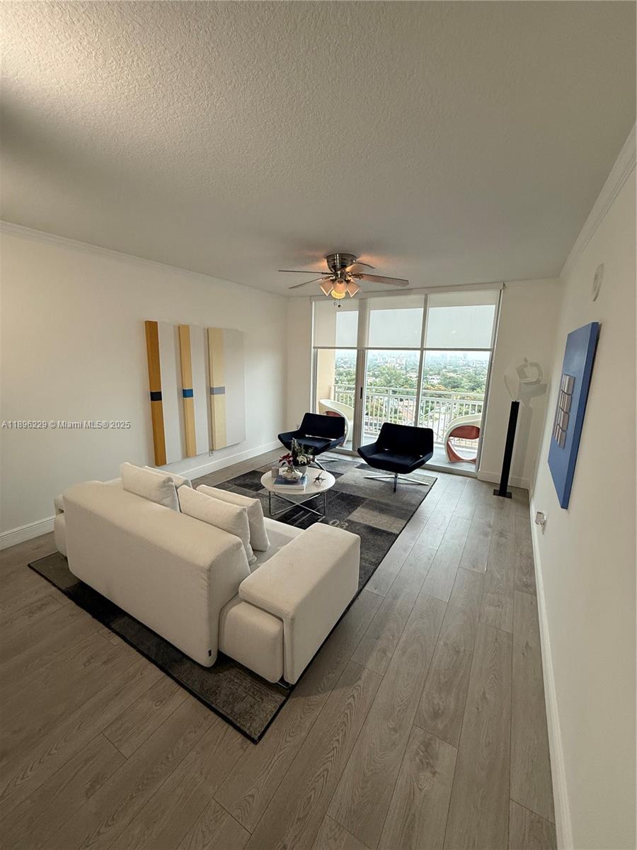 2665 Southwest 37th Avenue, Unit 1213 Miami, FL 33133 - Photo 14 of 54 a living room with furniture and a large window