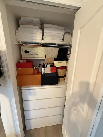 a bedroom with a bed and a desk