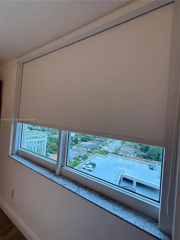 a view of a hallway with a large window