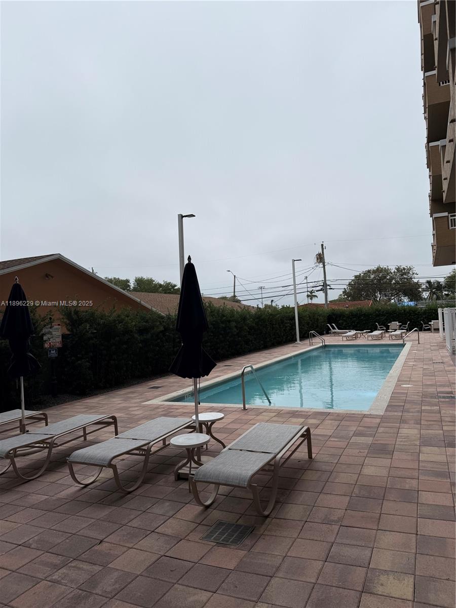 2665 Southwest 37th Avenue, Unit 1213 Miami, FL 33133 - Photo 45 of 54 a view of a terrace with chairs