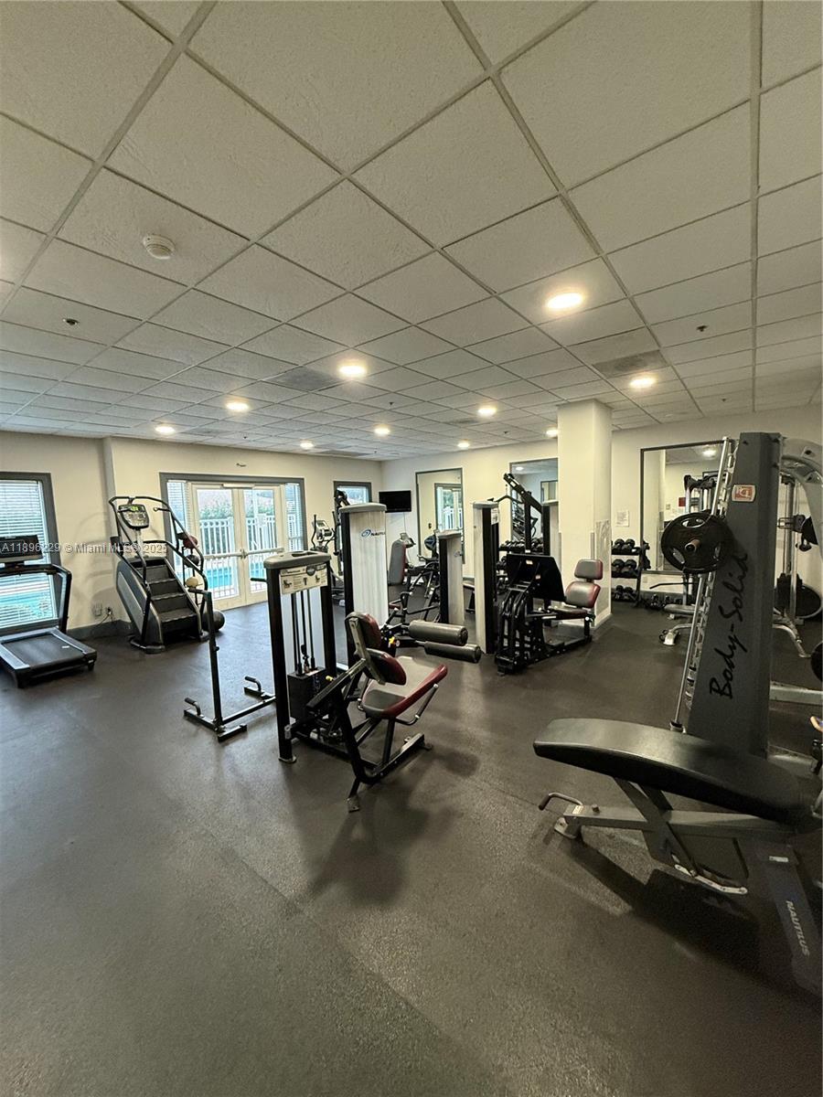 2665 Southwest 37th Avenue, Unit 1213 Miami, FL 33133 - Photo 47 of 54 a view of a room with gym equipment