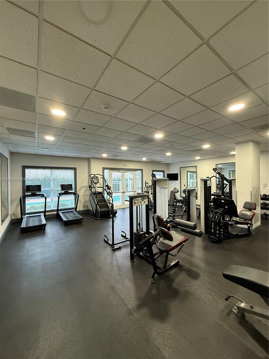 2665 Southwest 37th Avenue, Unit 1213 Miami, FL 33133 - Photo 49 of 54 a view of a room with gym equipment