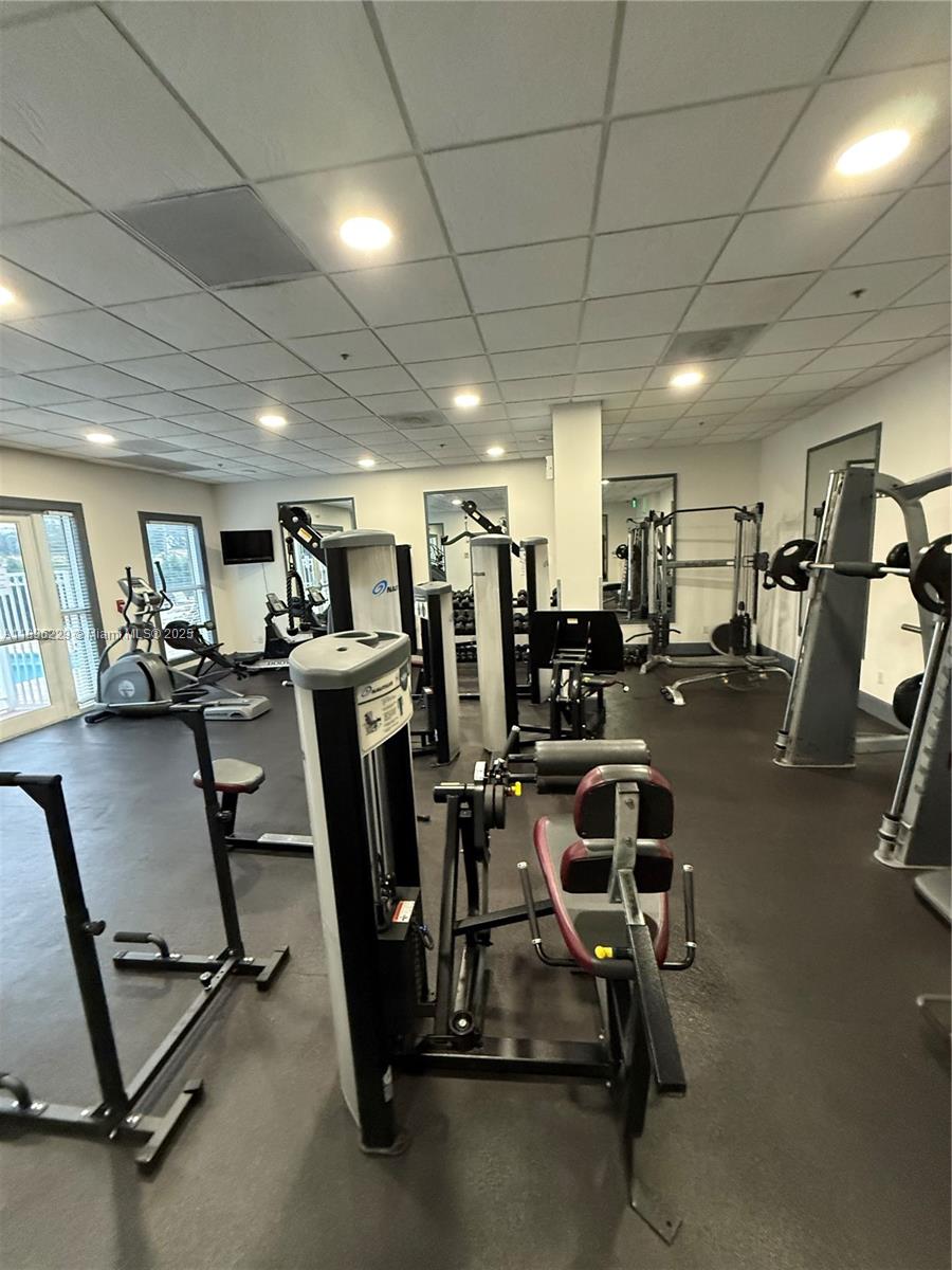 2665 Southwest 37th Avenue, Unit 1213 Miami, FL 33133 - Photo 50 of 54 a view of a room with gym equipment
