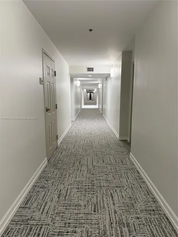 a kitchen with a sink a stove a refrigerator and cabinets