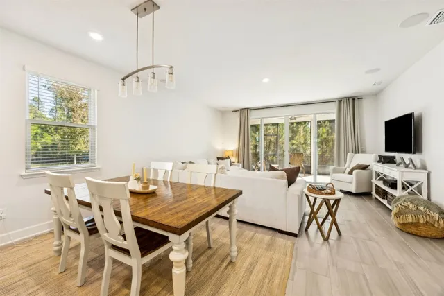 a kitchen with stainless steel appliances granite countertop a refrigerator and white cabinets