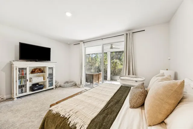 a bedroom with a bed and a chair