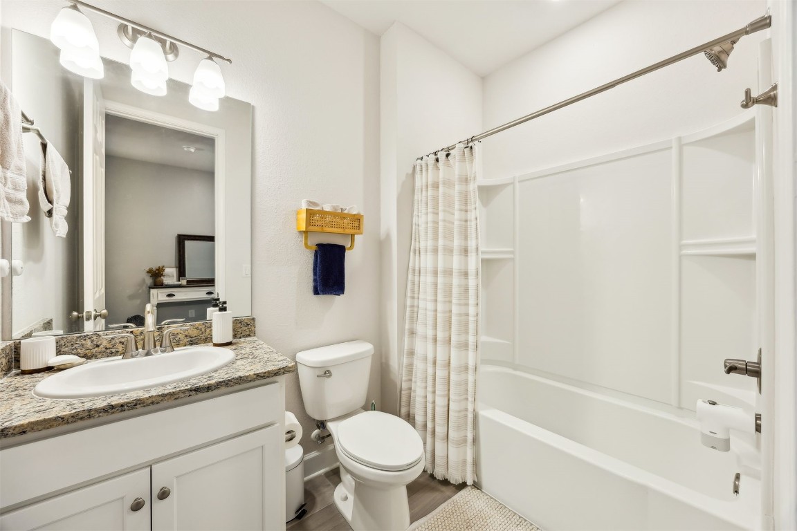 75968 Saffron Lane Yulee, FL 32097 - Photo 26 of 67 a bathroom with a granite countertop toilet sink and shower