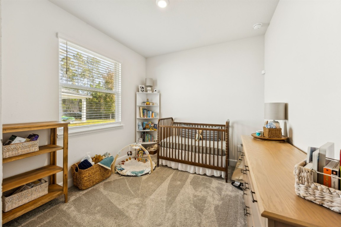 75968 Saffron Lane Yulee, FL 32097 - Photo 27 of 67 a bedroom with furniture and a window