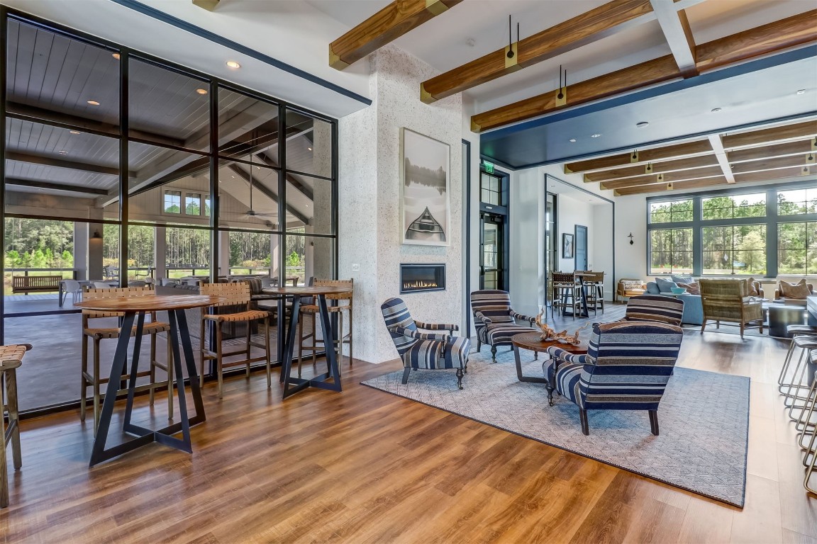 75968 Saffron Lane Yulee, FL 32097 - Photo 53 of 67 a living room with furniture a wooden floor and next to a window