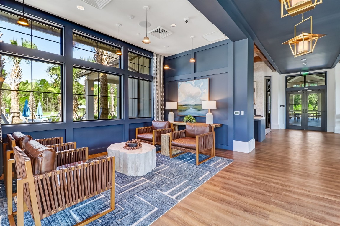 75968 Saffron Lane Yulee, FL 32097 - Photo 55 of 67 a living room with furniture and a floor to ceiling window