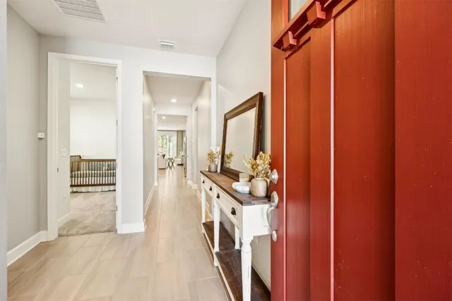 a dining room with stainless steel appliances kitchen island granite countertop a table chairs and a living room view