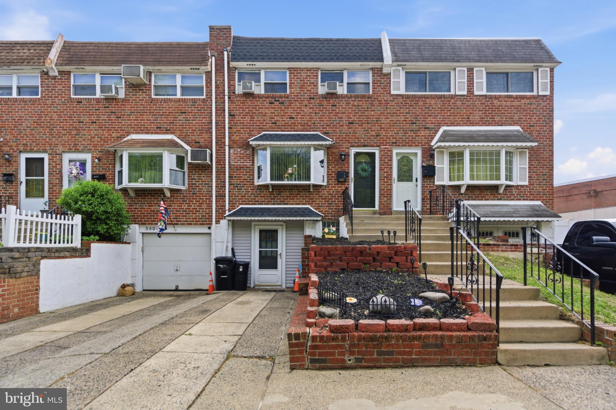 Charming brick townhouse with curb appeal.