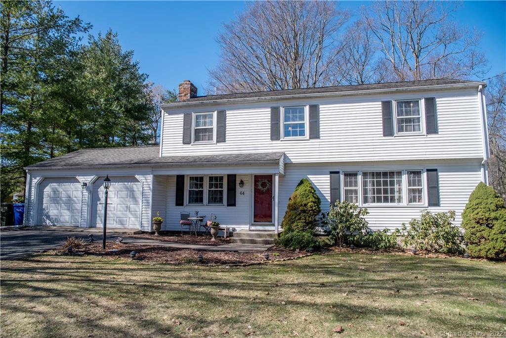 64 Ridgedale Road Bethel, CT 06801 - Photo 1 of 1 a front view of a house with lots of trees and plants