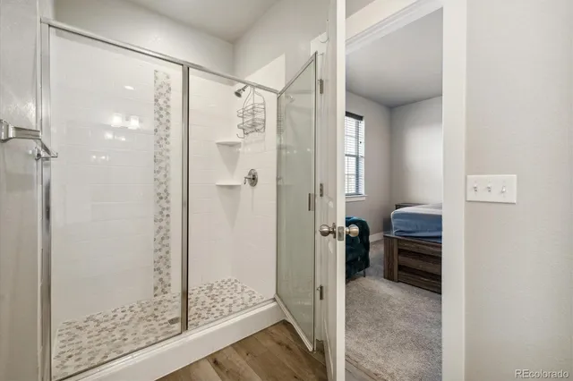 a bathroom with a sink a toilet a tub and a mirror