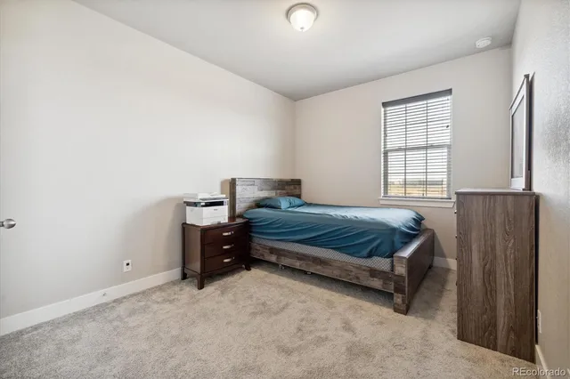 a room with gym equipment and a flat screen tv