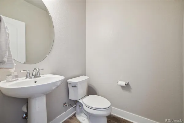 a view of washer and dryer with kitchen in the background