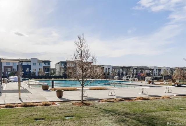 a view of a balcony with floor to ceiling windows with city view