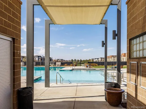 a view of a lake with houses and trees in the background