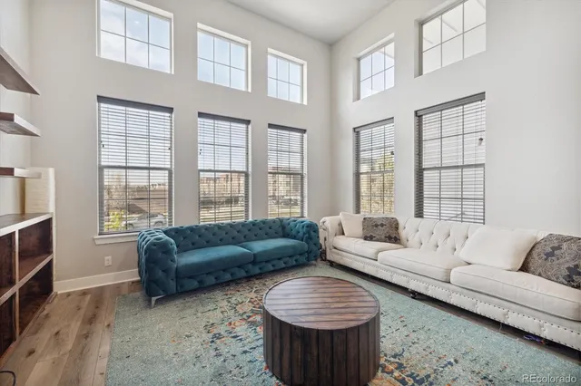 a living room with fireplace furniture and a flat screen tv