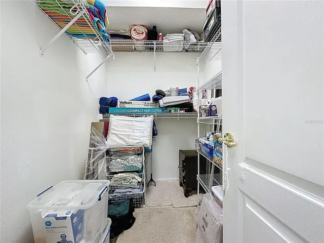 an aerial view of residential houses with outdoor space and swimming pool