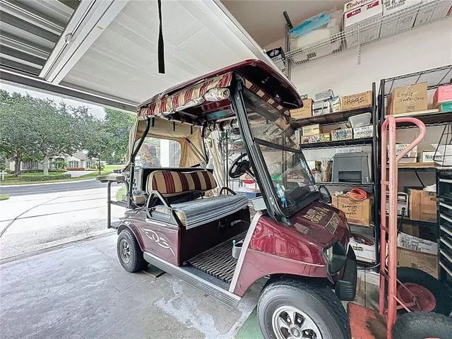 an aerial view of a residential houses with outdoor space and street view