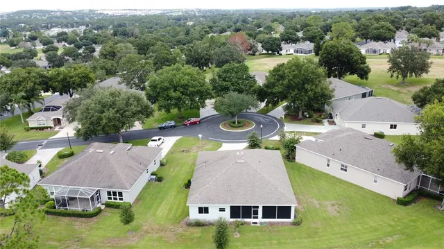 a large hall with stainless steel appliances granite countertop lots of wooden furniture