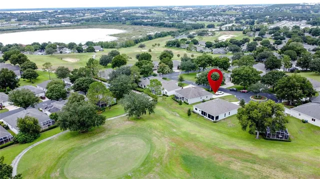 a living room with furniture and a book shelf