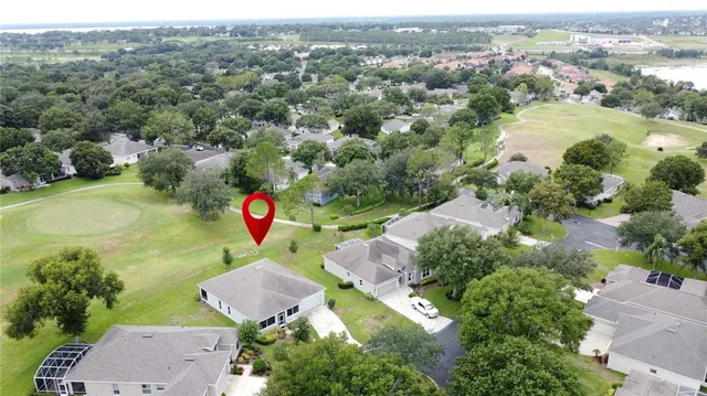 an aerial view of a house with a swimming pool