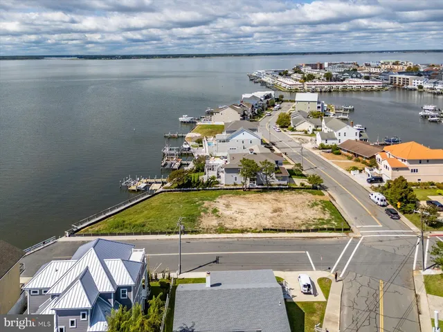 an aerial view of a residential houses with outdoor space