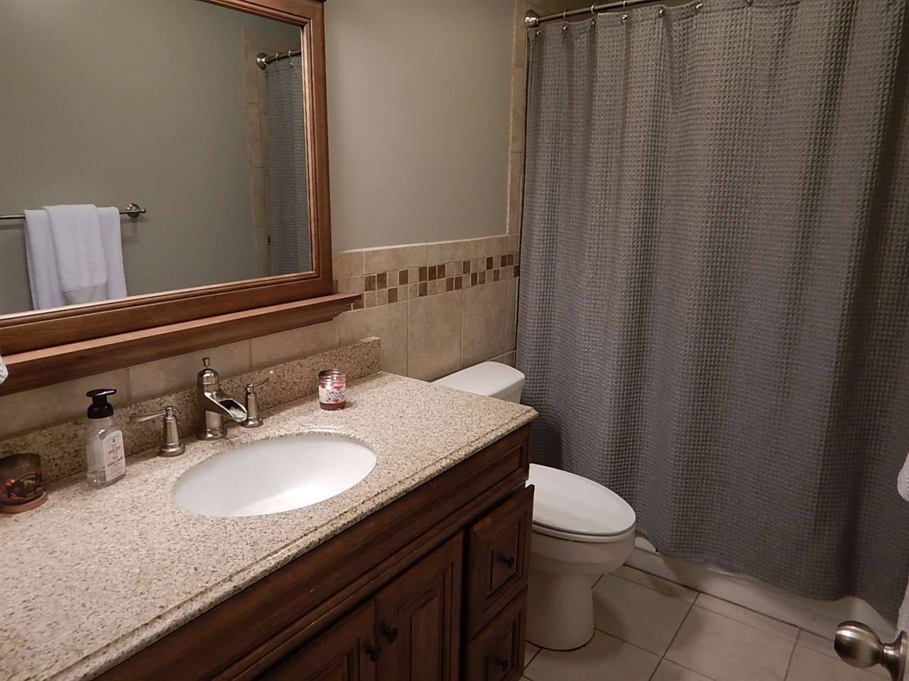 461 Dove Valley Road Collierville, TN 38017 - Photo 13 of 18 a bathroom with a granite countertop sink and a mirror