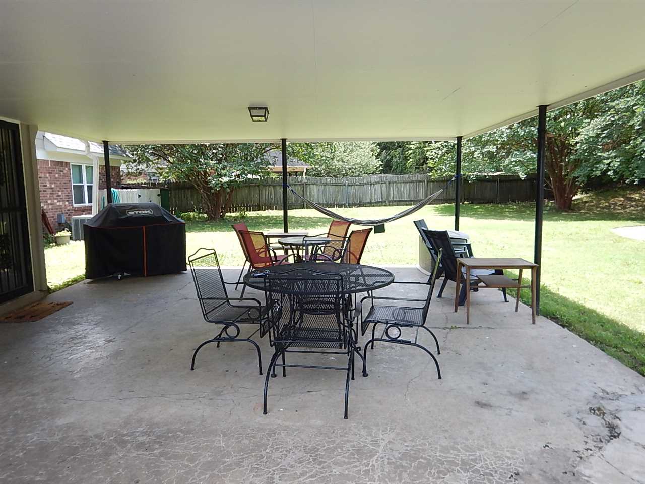 461 Dove Valley Road Collierville, TN 38017 - Photo 17 of 18 a view of a patio with a table and chairs