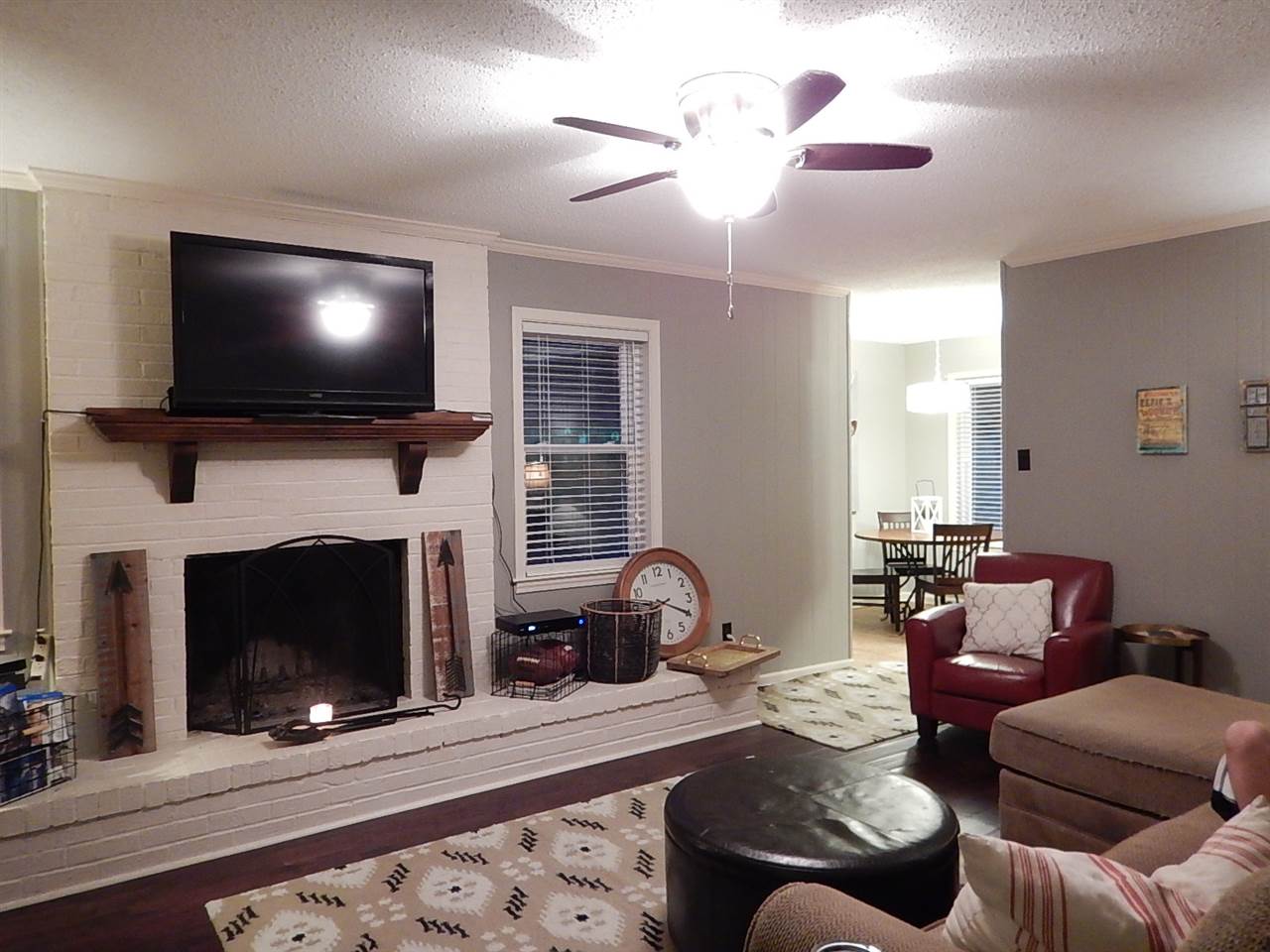 461 Dove Valley Road Collierville, TN 38017 - Photo 4 of 18 a living room with furniture a flat screen tv and a fireplace
