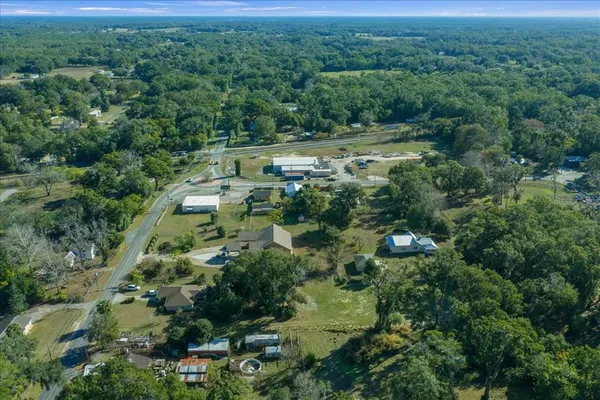 an aerial view of house with yard