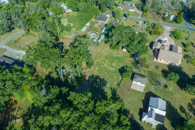 an aerial view of a town with trees