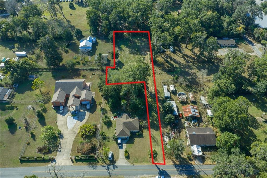 2026 Northeast 97th Street Road Anthony, FL 32617 - Photo 4 of 20 an aerial view of residential houses with outdoor space and street view