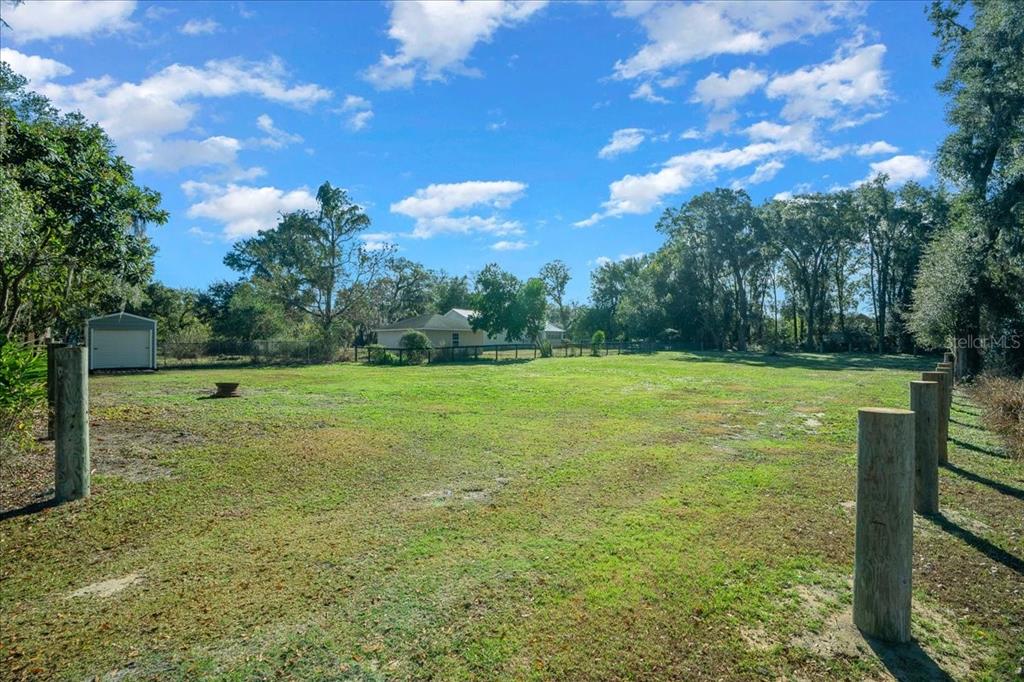 2026 Northeast 97th Street Road Anthony, FL 32617 - Photo 8 of 20 a view of a garden with a slide