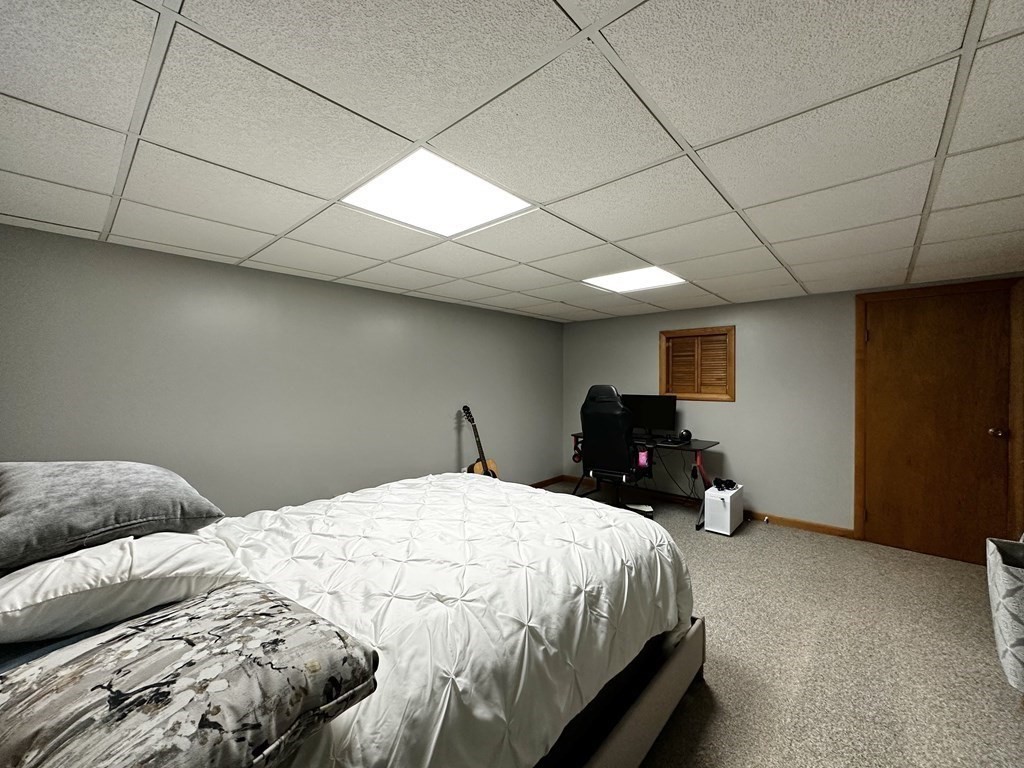 174 Chudy Street Three Rivers, MA 01080 - Photo 25 of 31 a bedroom with a bed and window