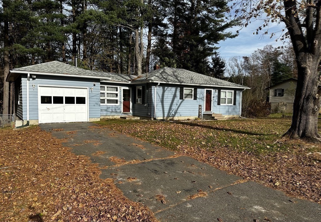 174 Chudy Street Three Rivers, MA 01080 - Photo 29 of 31 a front view of a house with a yard and trees