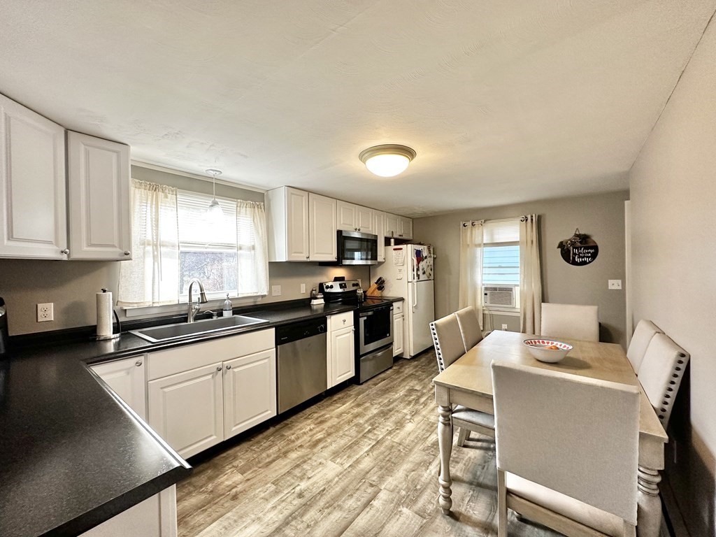 174 Chudy Street Three Rivers, MA 01080 - Photo 3 of 31 a kitchen with a sink cabinets and window