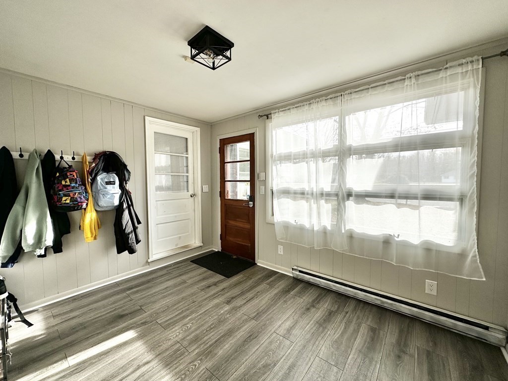 174 Chudy Street Three Rivers, MA 01080 - Photo 4 of 31 a view of empty room with wooden floor and fan