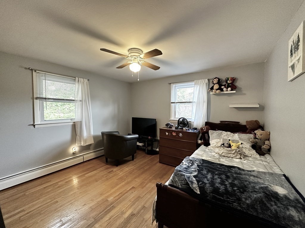 174 Chudy Street Three Rivers, MA 01080 - Photo 8 of 31 a bedroom with a large bed and a window