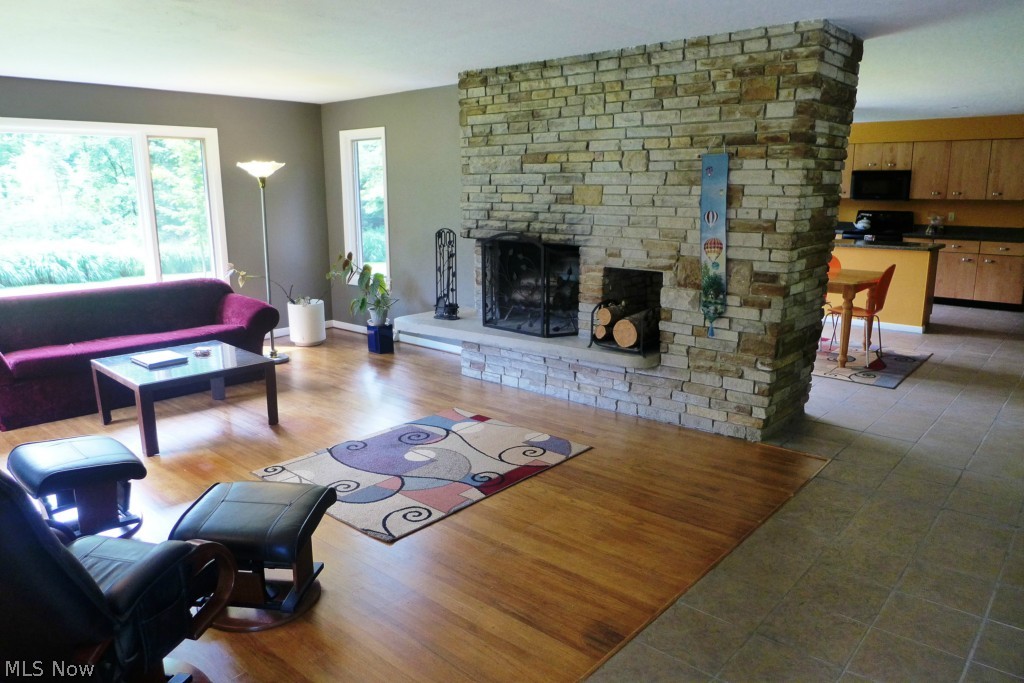 7609 Dines Road Novelty, OH 44072 - Photo 25 of 25 The fireplace has wood storage and has an open floor plan extending to the dining area and the kitchen!