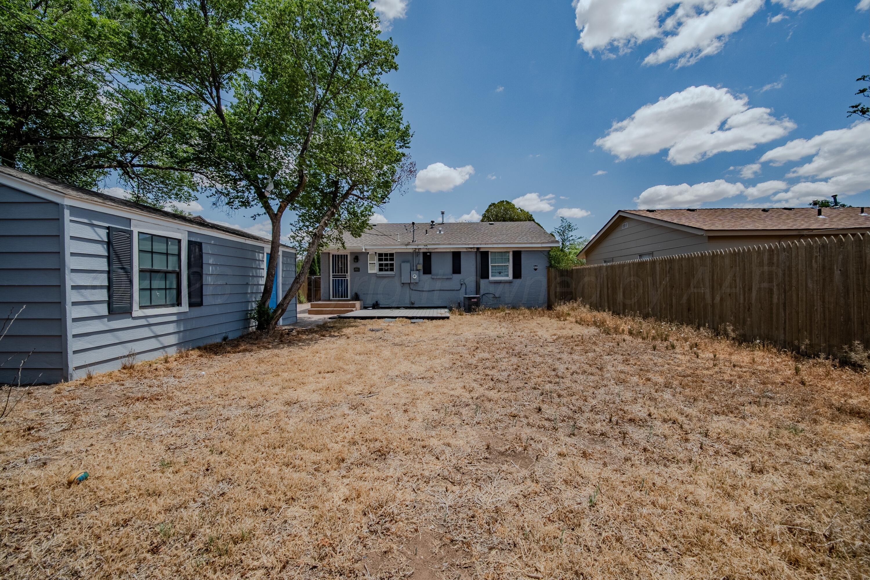 4014 Gables Street Amarillo, TX 79110 - Photo 12 of 14 a view of a house with a yard