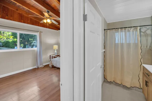 a view of an empty room and a window