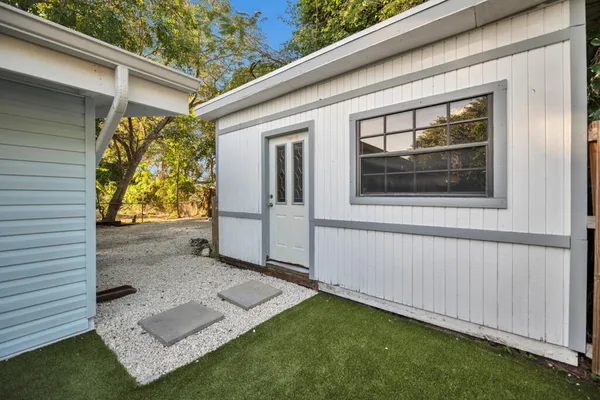 a view of backyard with cabin